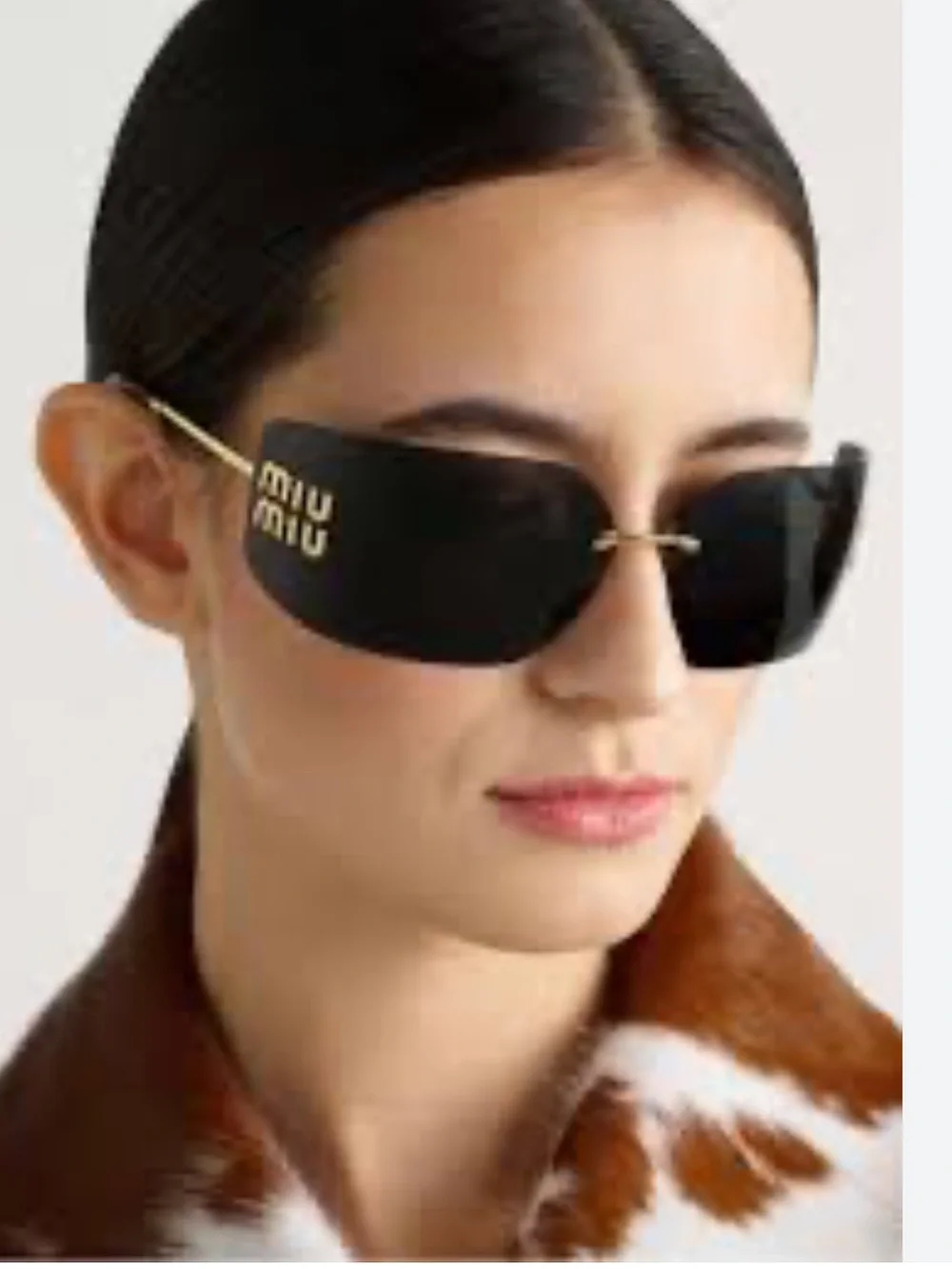 Miu Miu rectangle wrap sunglasses. Dark gray with gold logo. Authentic.